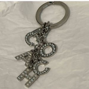 Coach crystal letter purse charm